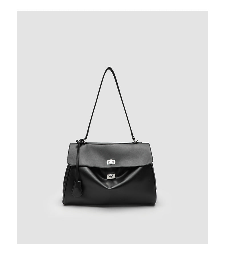 Structured black leather-look flap satchel bag with silver turn-lock hardware and top handle, detail view 19
