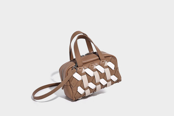 Small structured satchel bag with two-tone woven front panel, dual top handles, and detachable crossbody strap in tan brown