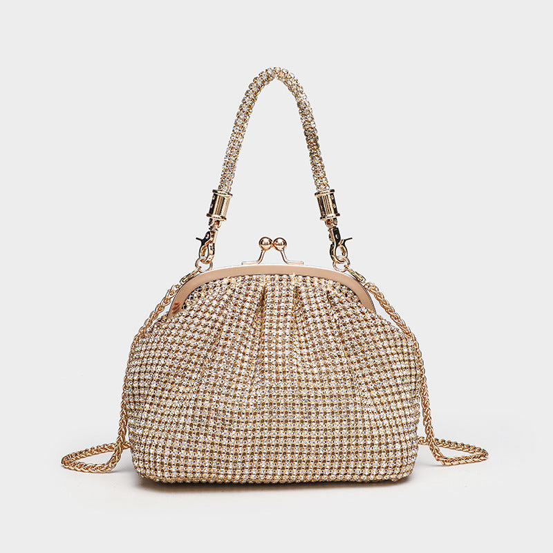 Kompakte Abendtasche mit rundum applizierten Strasssteinen, silberfarbenem Metallrahmen, Strass-Tragegriff und abnehmbarer Kette