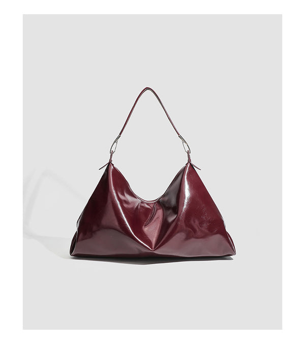 Glossy structured shoulder tote bag with silver-tone hardware and top zip closure, detail view 10
