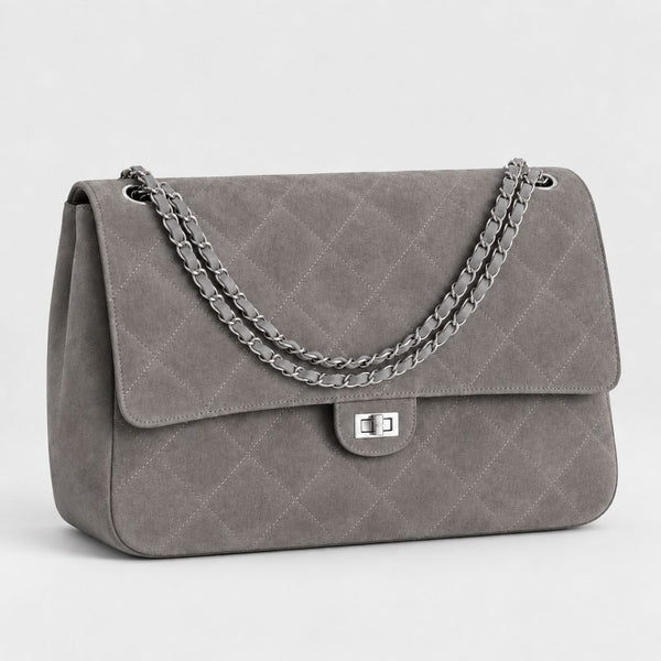 Quilted diamond-stitch flap shoulder bag with double silver chain strap and turn-lock closure in suede-look finish, front