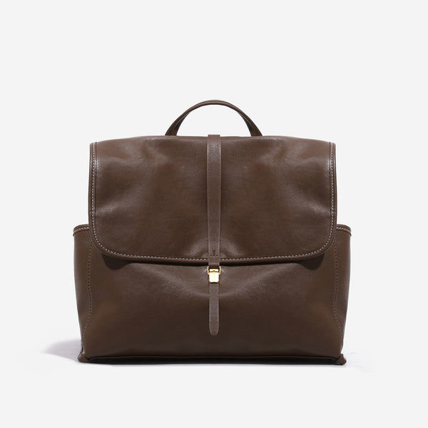 Structured retro flap backpack handbag in brown leather-look finish with gold-tone toggle clasp and top handle, detail view 7