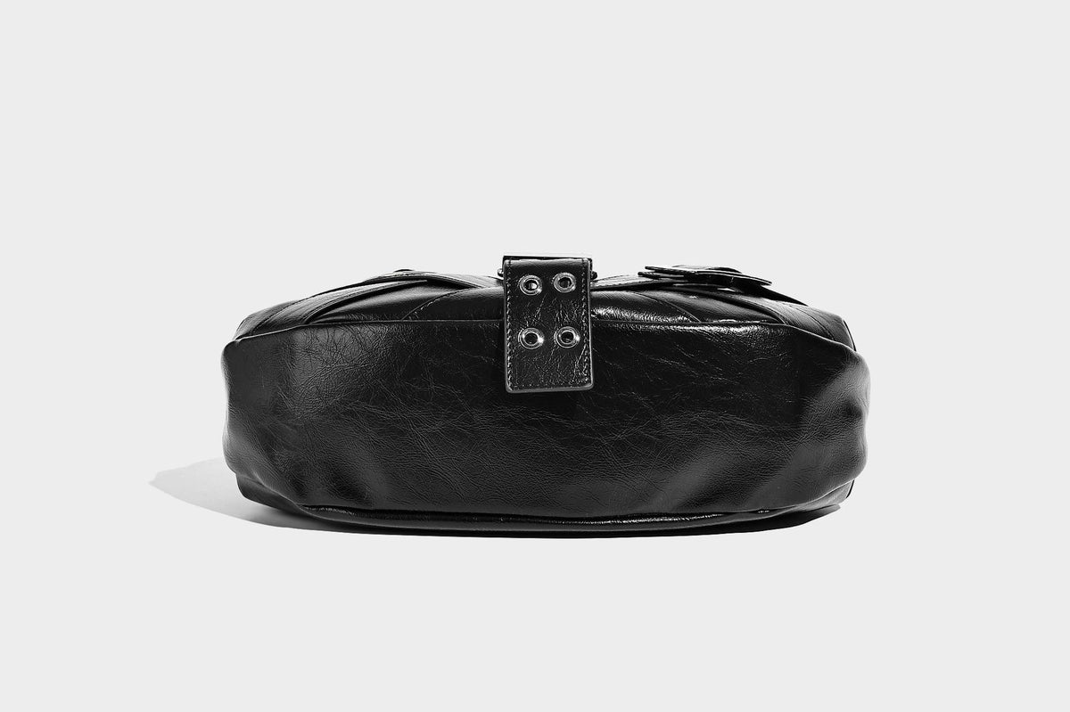 Glossy crescent hobo bag with silver-tone grommets, square buckle straps, and top zipper closure, detail view 23