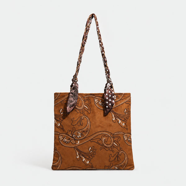 Brown suede-finish tote bag with paisley embroidery and braided fabric-ribbon shoulder strap, detail view 3