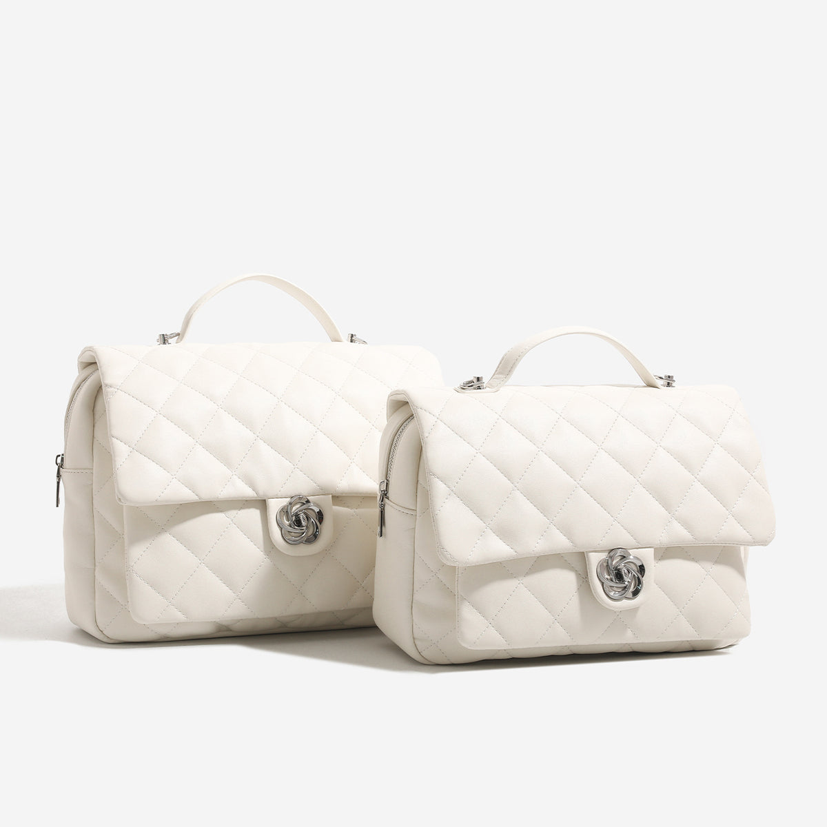 Diamond-quilted flap backpack handbag with silver-tone flower turn-lock, top handle, and dual shoulder straps, detail view 3