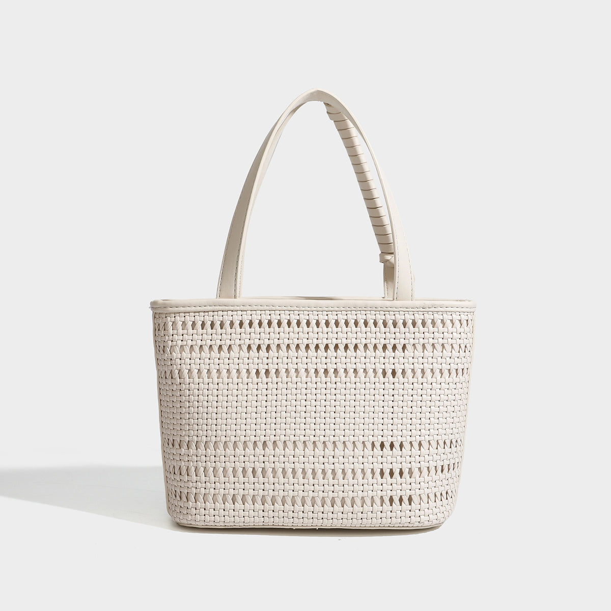 Structured open-weave tote bag with smooth leather-look trim, double top handles, detachable crossbody strap, and mini zip