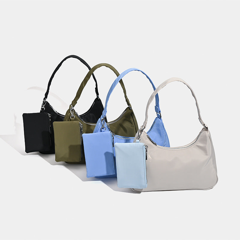 Curved hobo shoulder bag with detachable zip pouch in matte-satin finish with silver-tone hardware, detail view 2