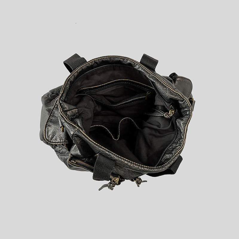 Slouchy crinkled pebbled leather-look convertible tote bag in gunmetal black with woven top handles, adjustable shoulder