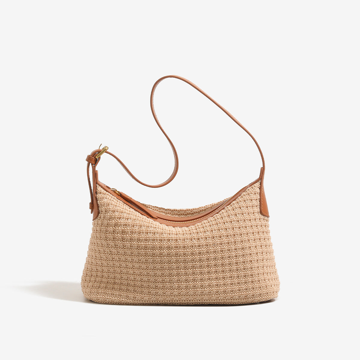 Beige woven raffia-style hobo shoulder bag with caramel leather-look trim, gold-tone zip closure, and adjustable strap