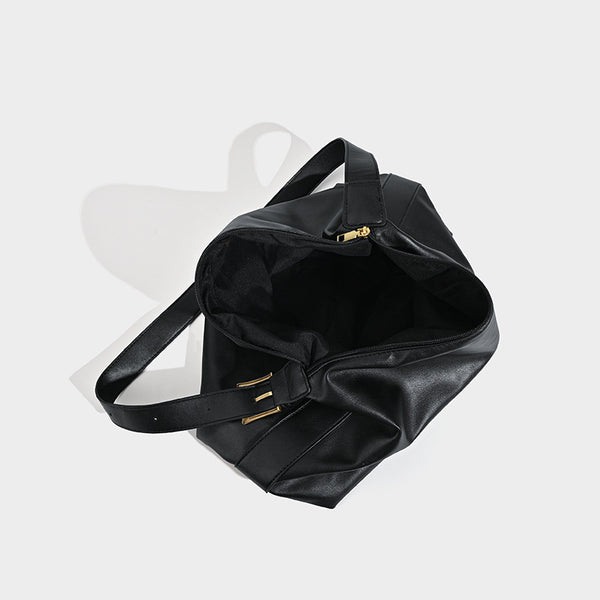 Large slouchy hobo shoulder bag in smooth black leather-look finish with gold-tone buckle hardware and adjustable strap
