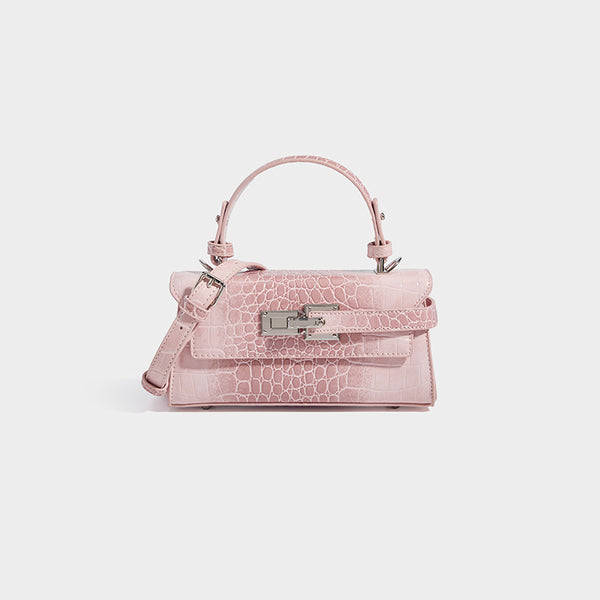 Mini-Henkeltasche mit strukturierter Form und Krokoprägung, silberfarbenem Drehverschluss und abnehmbarem Schulterriemen, Detailansicht