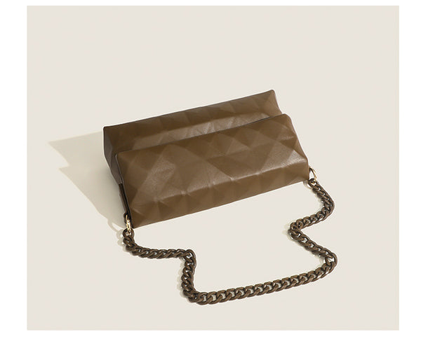 Cream white rectangular flap shoulder bag with geometric faceted surface and chunky tone-on-tone chain strap with gold-tone