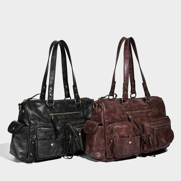 Distressed leather-look vintage satchel shoulder bag with multiple front zip pockets, dual top handles, and brass-tone