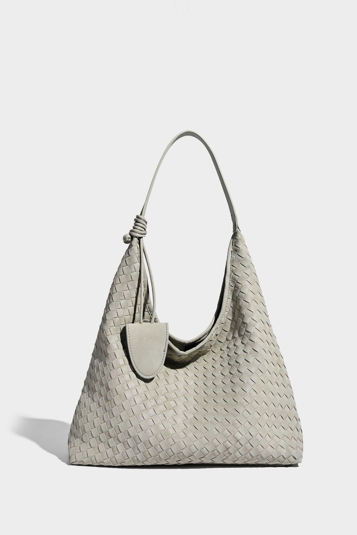 Slouchy woven hobo shoulder bag with knotted strap and matte leather-look textured finish, detail view 19