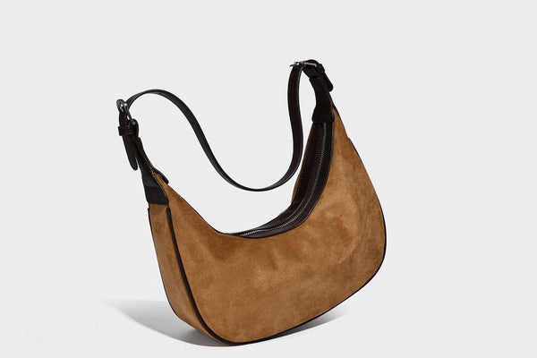 Crescent hobo shoulder bag in matte suede-look finish with black trim and adjustable strap, detail view 28