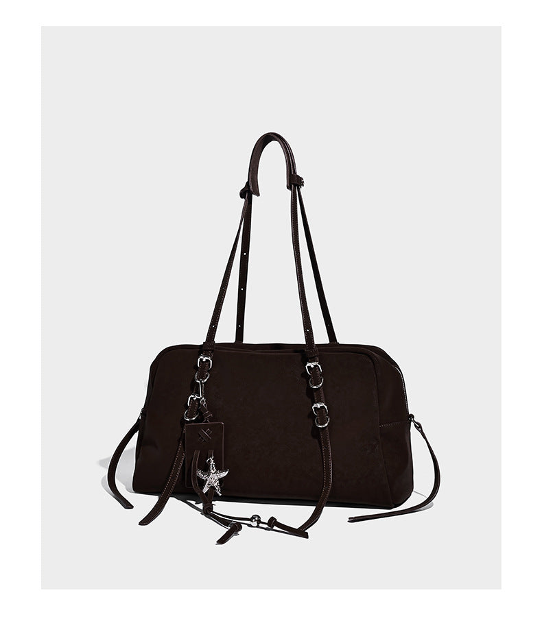 Structured rectangular matte suede-like shoulder bag with silver-tone hardware, zip closure, double top handles, and, detail