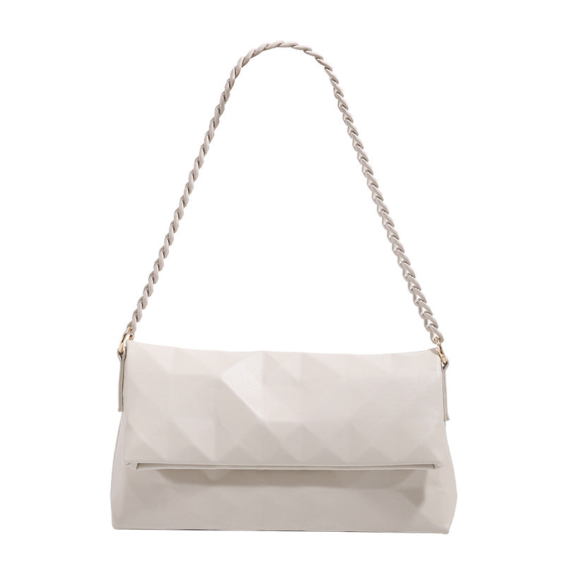 Geometric faceted flap shoulder bag with braided chain strap in black and ivory leather-look finish, detail view 5