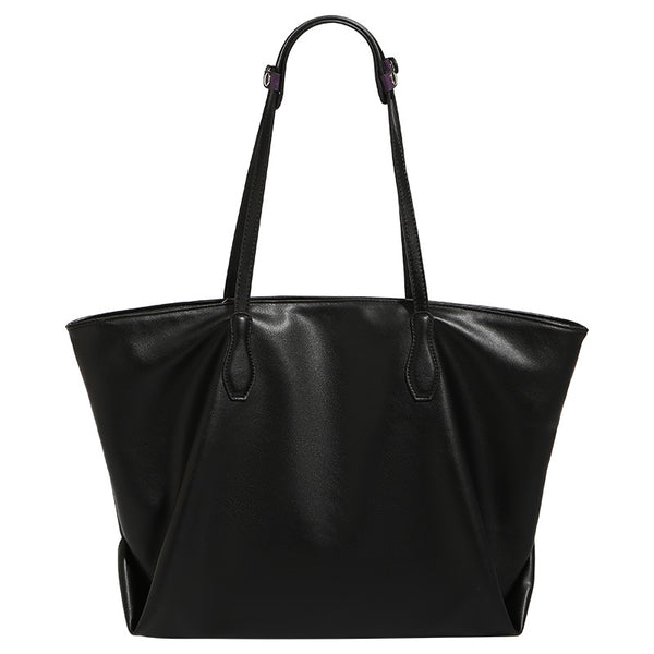 Large black leather-look trapezoid tote bag with double shoulder straps and purple accent hardware, detail view 5