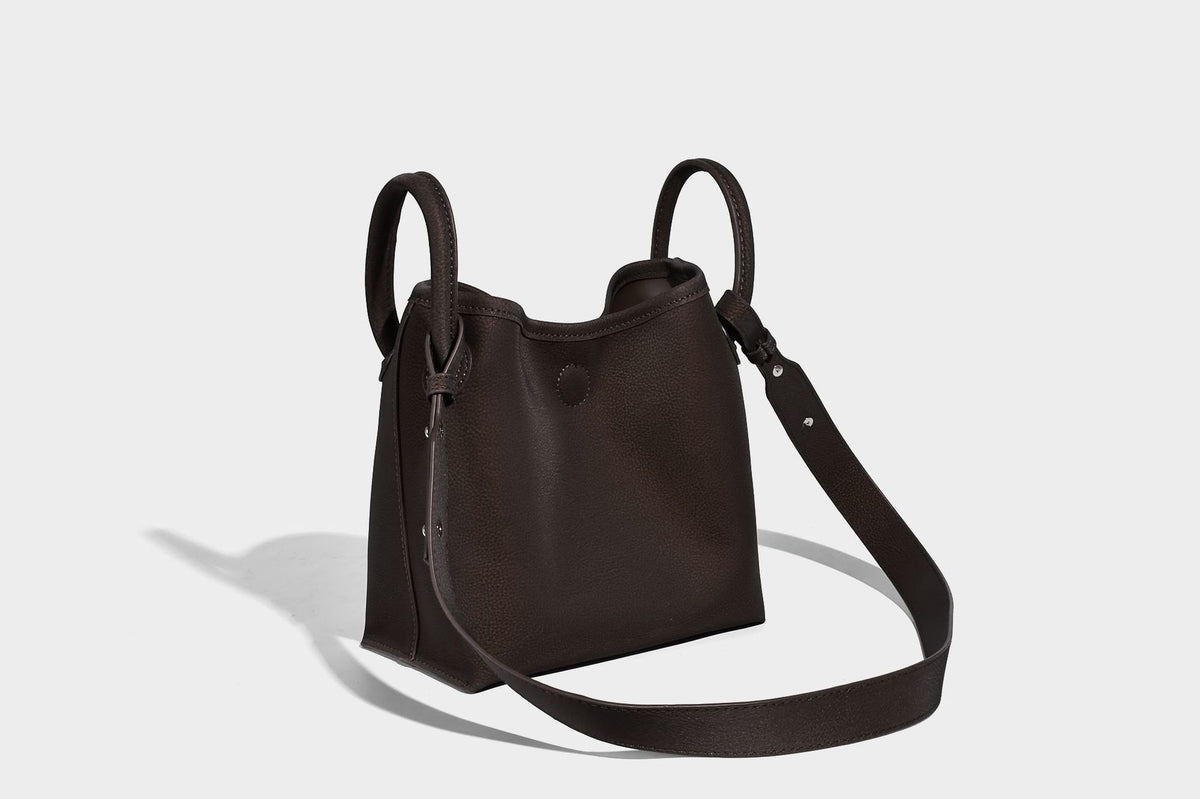 Small structured matte pebbled tote bag with twin top handles and removable zip pouch, detail view 16