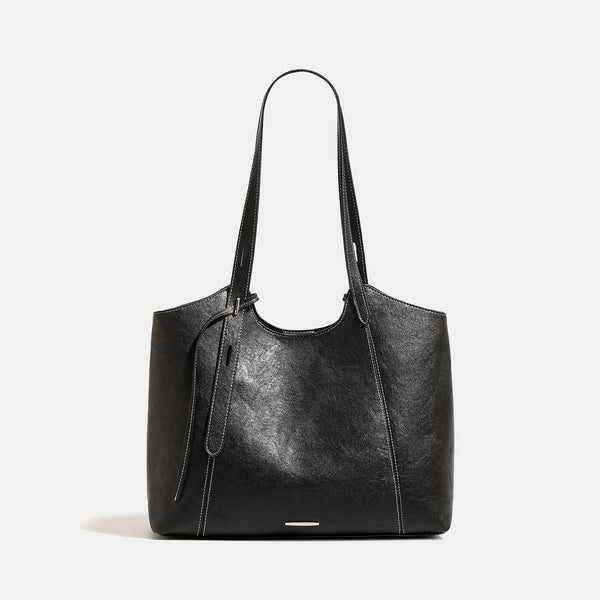Structured open-top leather-look tote bag with long shoulder straps, contrast stitching, and side tie details, detail view 6