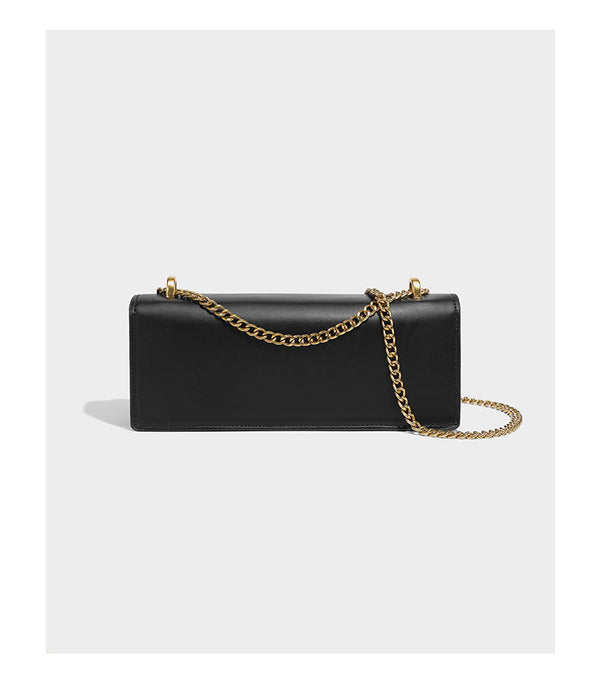 Slim rectangular crossbody bag with gold-tone butterfly metal appliqués and fine antiqued chain strap, detail view 8