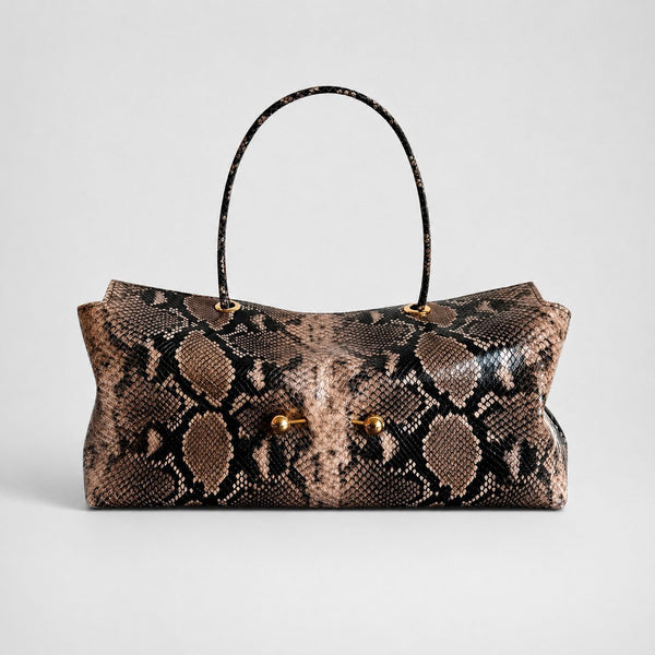 Wide embossed-texture shoulder tote bag with single loop handle and gold-tone toggle hardware, detail view 7