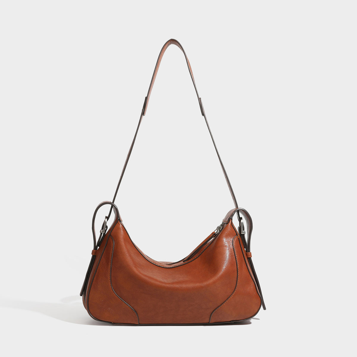 Dark brown curved zip-top hobo shoulder bag with slim adjustable strap and silver-tone hardware, detail view 3