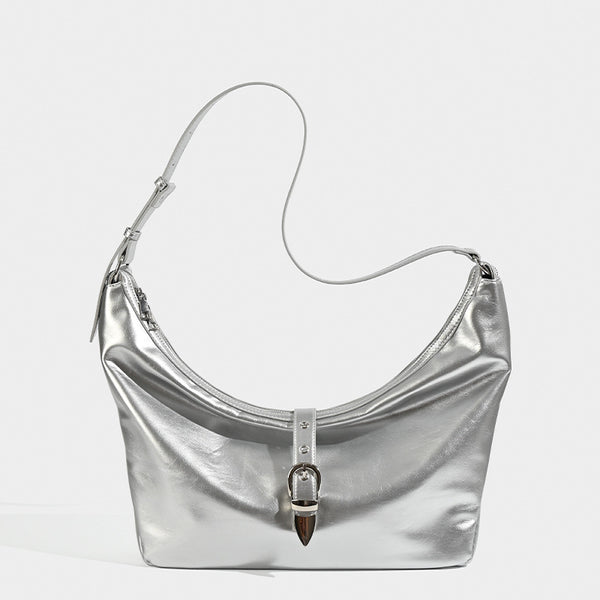 Slouchy crescent hobo bag with glossy leather-look finish, silver-tone buckle hardware, and flat shoulder strap, front view