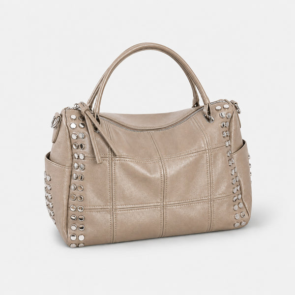 Black leather-look satchel bag with gunmetal rivet trim, grid-stitched paneling, dual rolled top handles, and curved zip