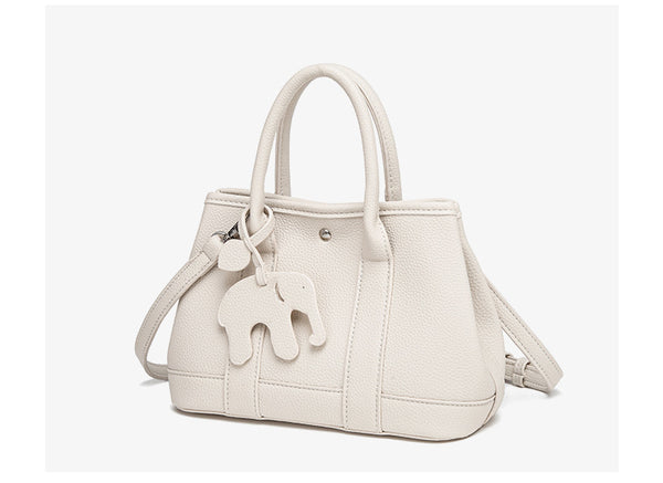 Structured pebbled leather-look top-handle tote bag with elephant charm and detachable shoulder strap, detail view 17