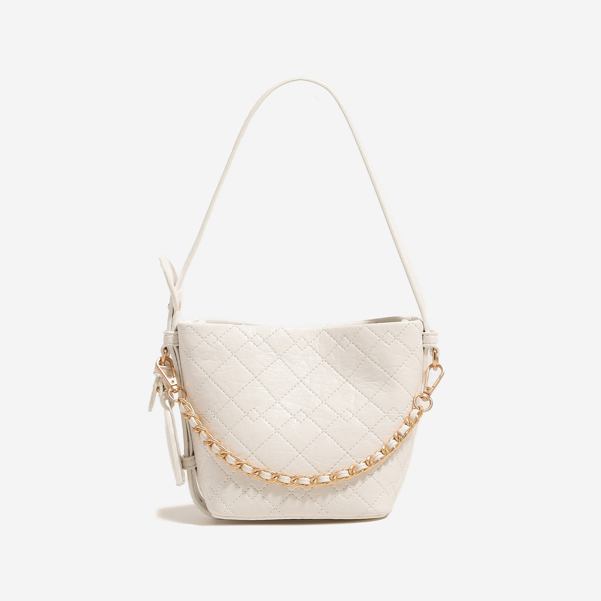 Small diamond-quilted bucket bag with gold-tone chain accent, heart strap detail, hanging tag, and matching zip coin pouch