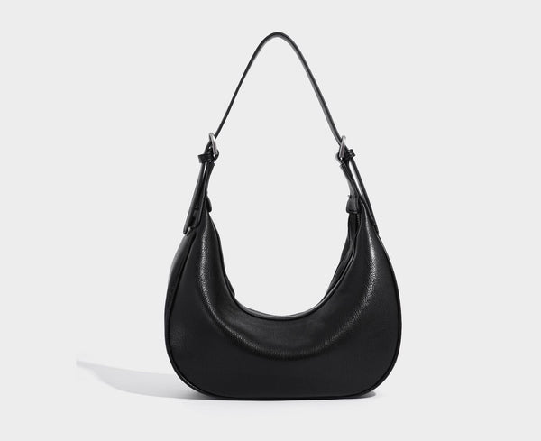 Crescent half-moon shoulder bag in pebbled leather-look finish with adjustable strap and silver-tone hardware, detail view 17