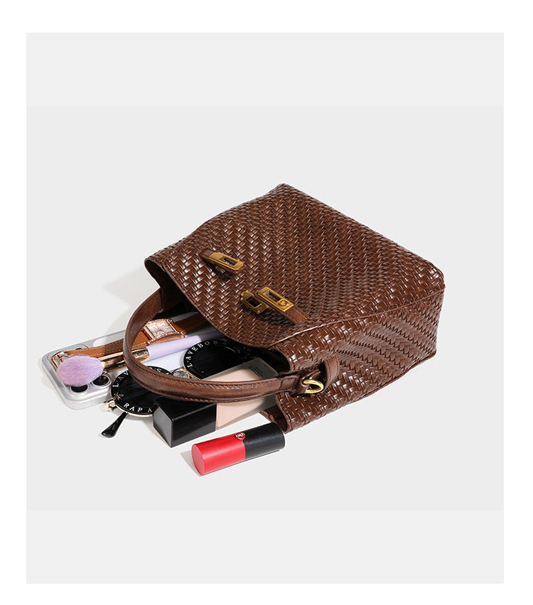 Structured woven leather-look bucket bag with gold-tone turn-lock hardware and detachable shoulder strap, detail view 28