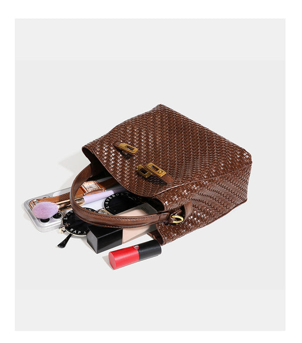 Structured woven leather-look bucket bag with gold-tone turn-lock hardware and detachable shoulder strap, detail view 28