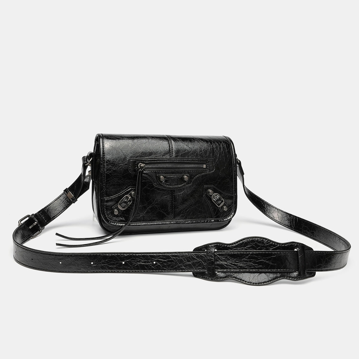 Small structured rectangular crossbody bag with crinkle leather-look finish, front zip pocket, gunmetal stud hardware, and