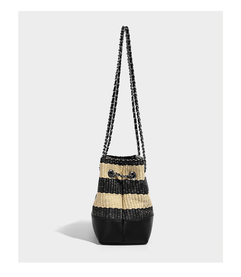Structured black and beige striped woven shoulder bag with silver chain strap and turn-lock metal clasp, detail view 8