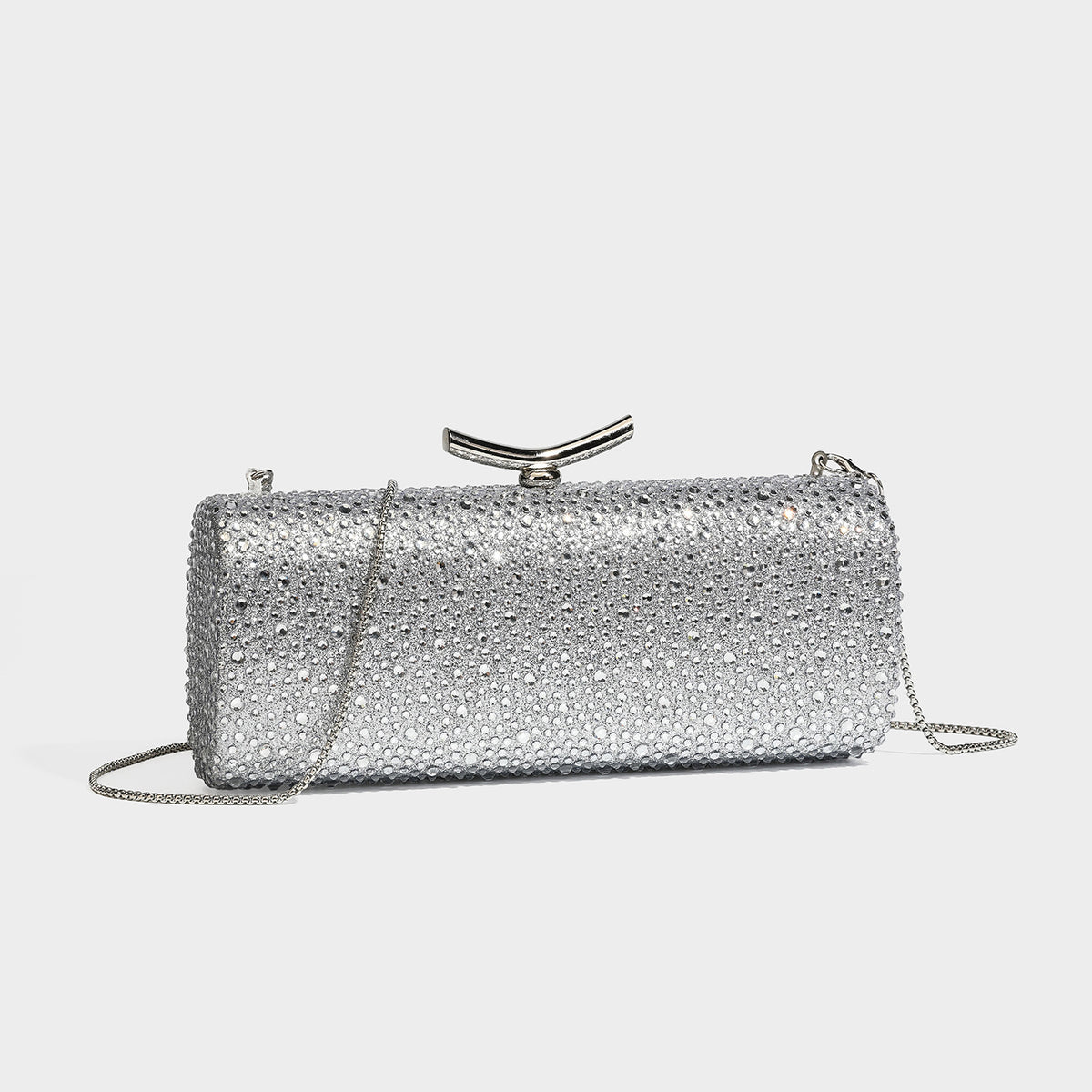 Structured rectangular hard-case clutch bag covered in all-over rhinestone crystal embellishment with curved kiss-lock top