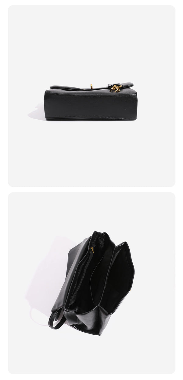 Strukturierte schwarze Klapp-Henkeltasche in Lederoptik mit goldfarbener Kettenhenkel, Drehverschluss und baumelndem Schlüsselanhänger, Detail