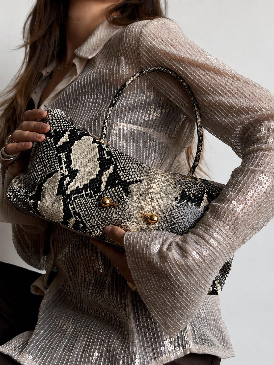 Wide embossed-texture shoulder tote bag with single loop handle and gold-tone toggle hardware, detail view 17