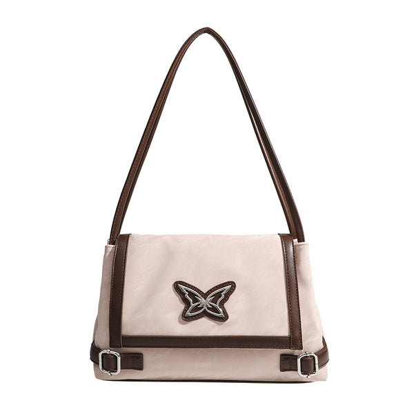 Structured crinkle-finish flap shoulder bag with butterfly metal appliqué and dark brown contrast trim, detail view 5