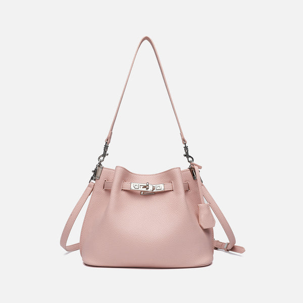 Soft-structured pebbled leather-look bucket bag with silver turn-lock front clasp and adjustable crossbody strap, detail view