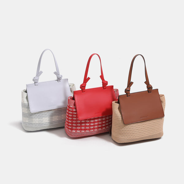 Structured woven tote bag with smooth leather-look front flap panel, knotted top handles, and detachable crossbody strap