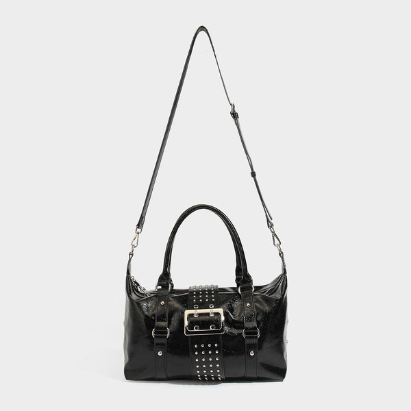 Glossy crinkled barrel handbag with silver stud buckle strap and detachable shoulder strap, detail view 4