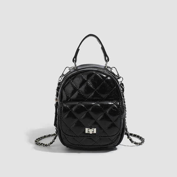 Quilted leather-look backpack purse with chain strap and turn-lock front pocket, detail view 7