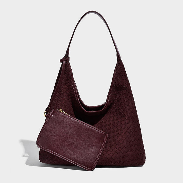 Large slouchy woven hobo tote bag with curved shoulder strap and triangular silhouette, detail view 8