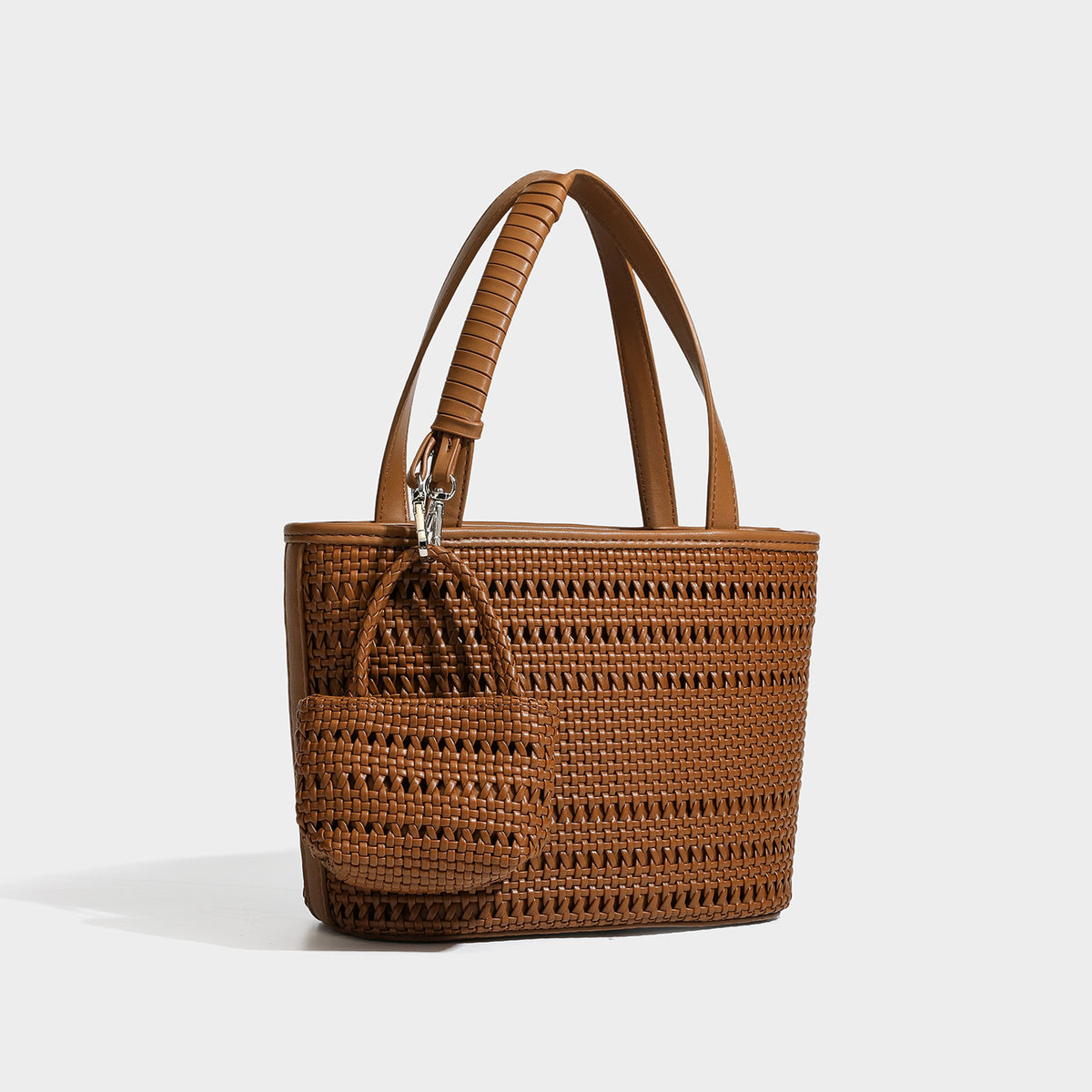 Structured open-weave tote bag with smooth leather-look trim, double top handles, detachable crossbody strap, and mini zip