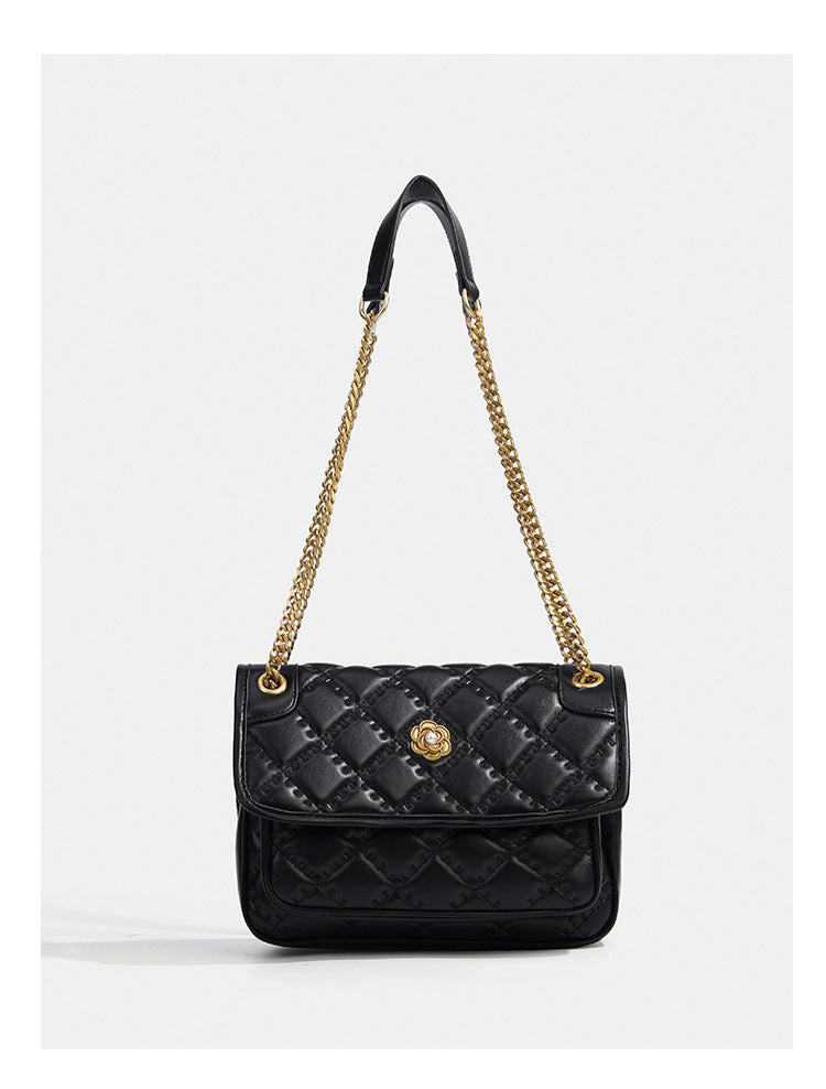 Compact diamond-quilted flap shoulder bag with gold-tone chain strap and floral turn-lock clasp, detail view 12