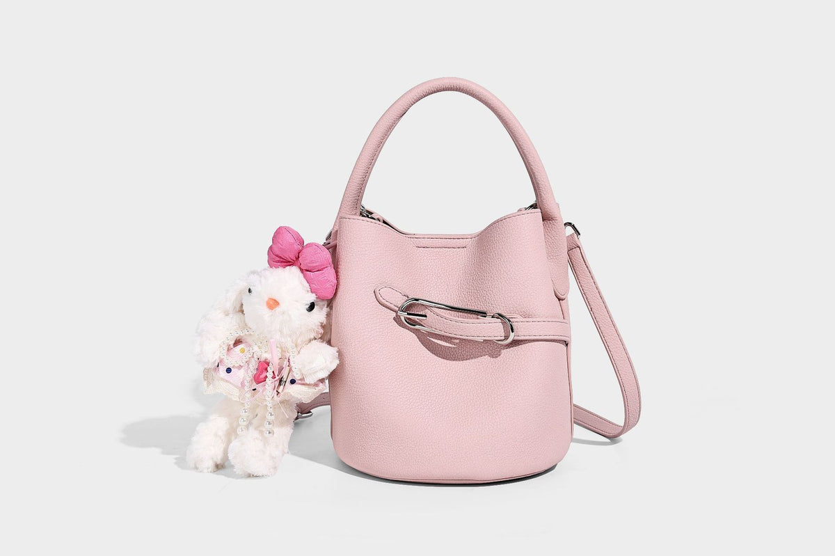 Mini pebbled leather-look bucket bag with front buckle strap, silver-tone hardware, top handle, and detachable shoulder