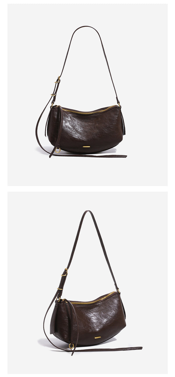 Compact soft rounded zip-top shoulder bag with gold-tone hardware and adjustable crossbody strap, detail view 11