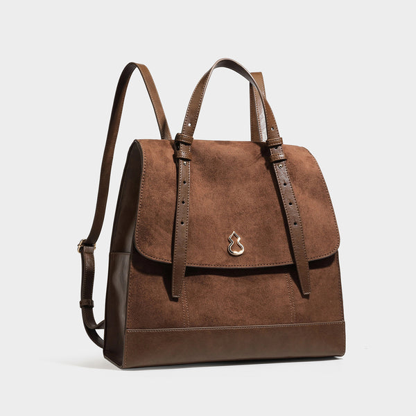 Structured suede-look convertible backpack handbag with flap closure and gold-tone emblem hardware in chocolate brown, front